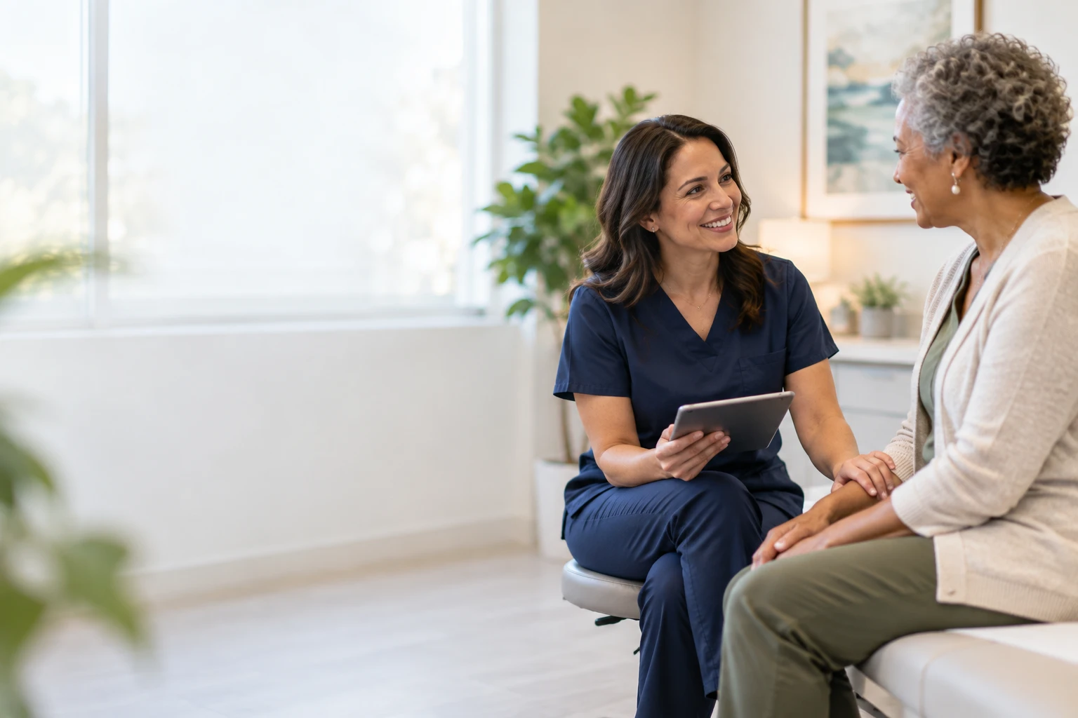 A Divine Health & Wellness provider talking with a patient